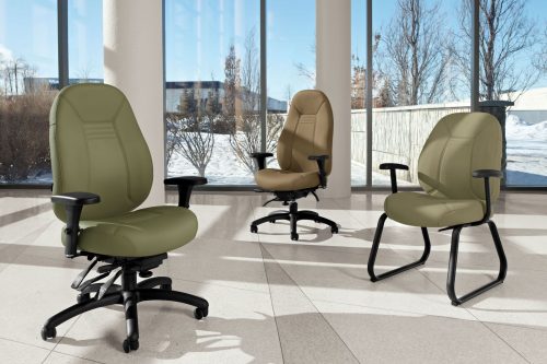 Studio shot of three Obusforme Comfort arranged in a large office space.
