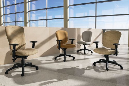 Studio shot of four Supra X office chairs on the mezzanine. One high backed model of this chair is next to a trio of medium backed chairs, an armless chair in back.