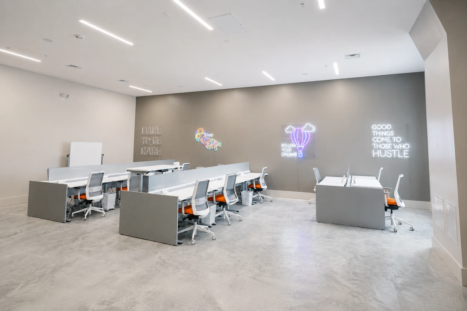 Wide view of the Nan Properties office combining lounge seating with open workstations