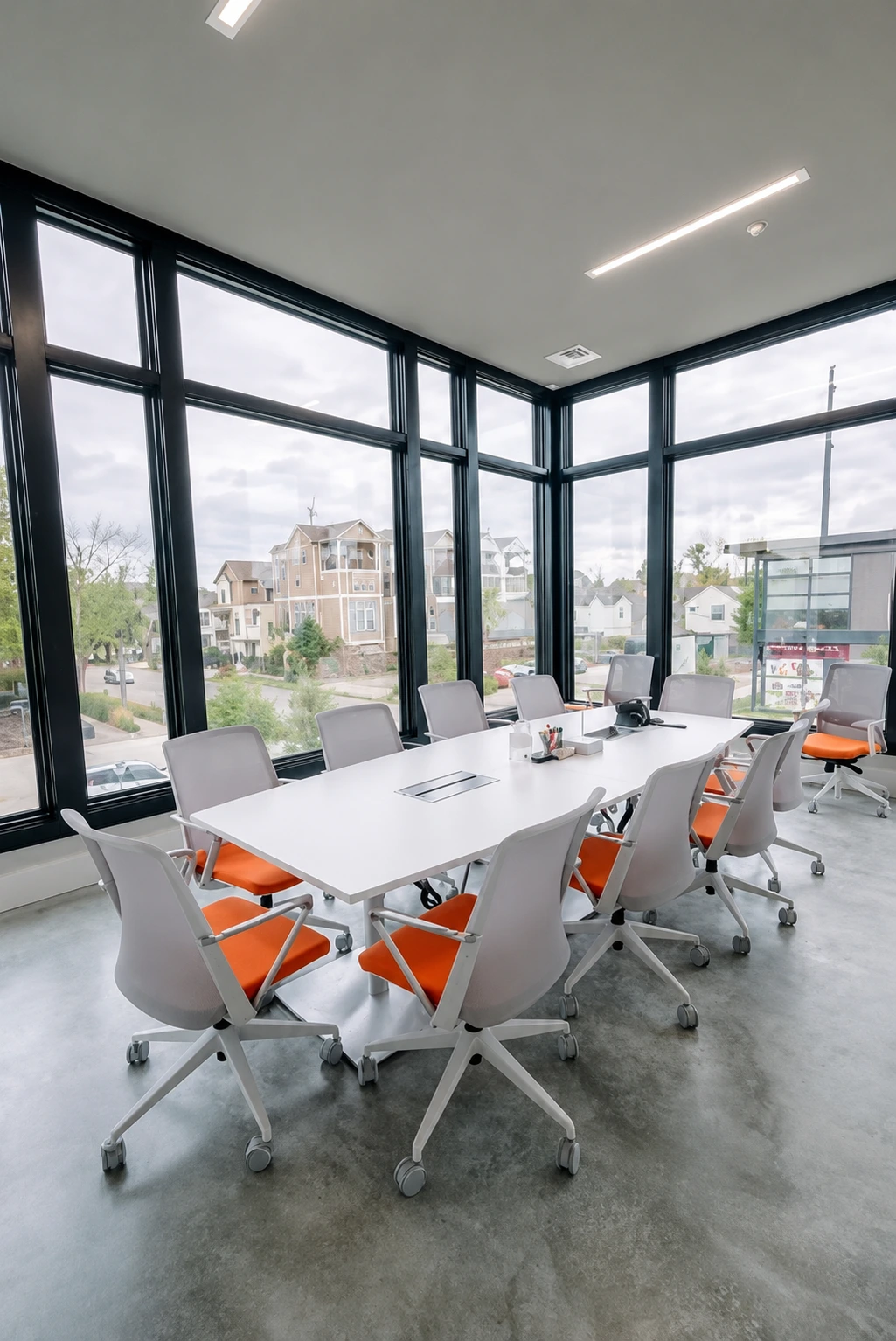 Private huddle room with lounge seating for confidential calls and client discussions